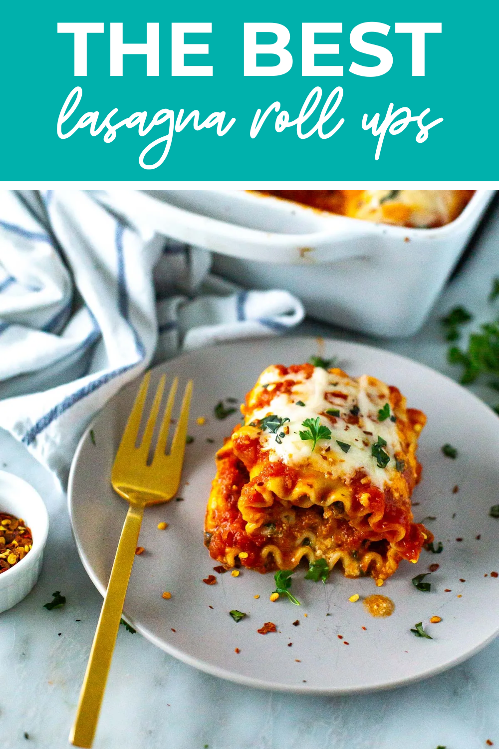 A lasagna roll up on a plate with the text "The Best Lasagna Roll Ups" on top.